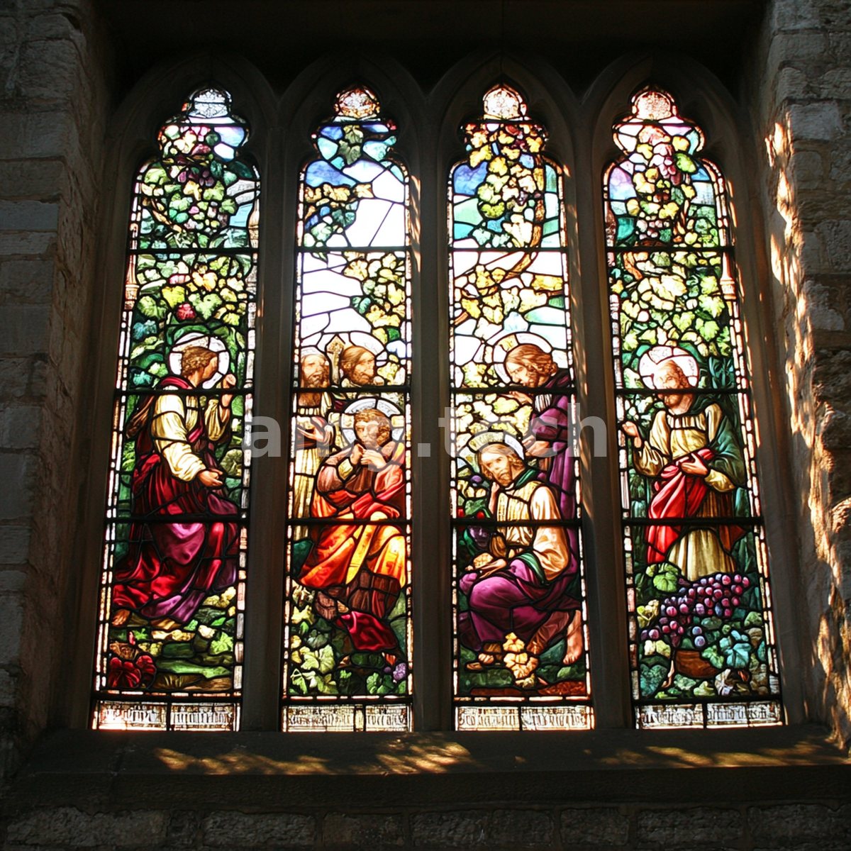 Four soaring lancet windows of stained glass depict haloed figures amid climbing grapevines, jewel-toned light spilling across ancient stone.